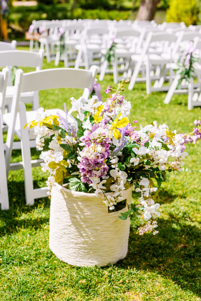 wedding decor and setup at the Windmill House on lawn next to trees and lake in Northern Arizona Chino Valley