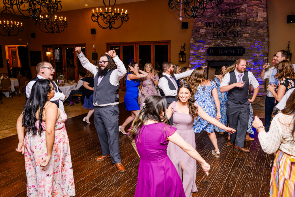 bridesmaids and guests on dance floor during reception at the Windmill House in Chino Valley Prescott Arizona 