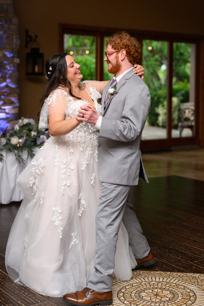 bride and groom dancing first dance on dance floor during reception at the Windmill House in Chino Valley Prescott Arizona 